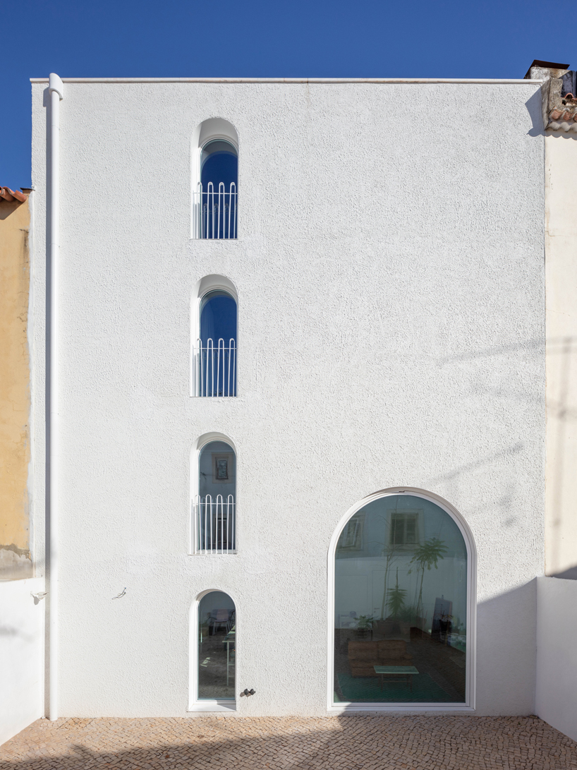 minimal 'dodged house' in lisbon pays tribute to irving gill's architecture