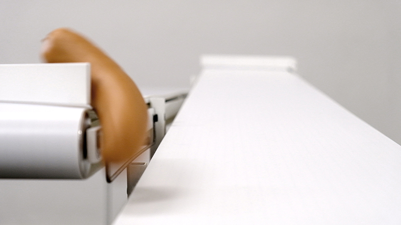 studio jephrim and jan bernstein's looping sausage takes food production in the gallery space