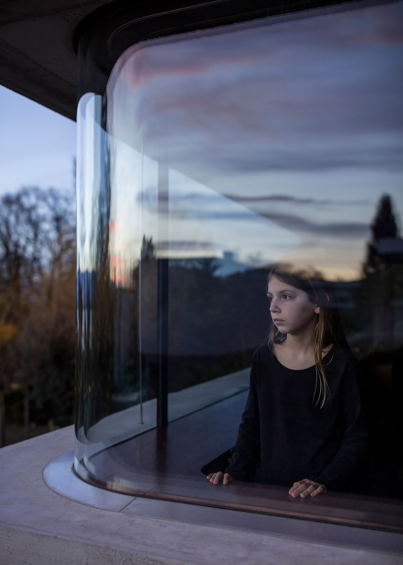 swiss cabin offers cinematic views of lake geneva through a 10 meter-wide window