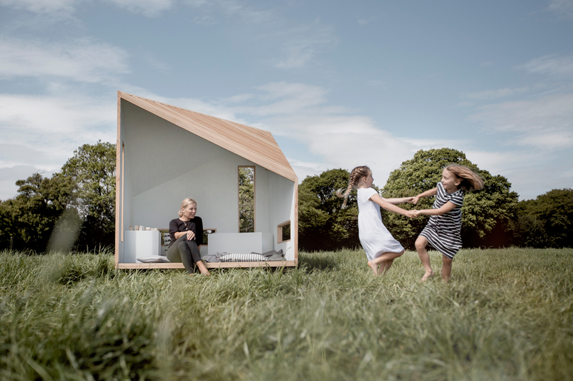 koto prefabricates the 'ilo playhouse' for children using larch timber and recycled rubber designboom