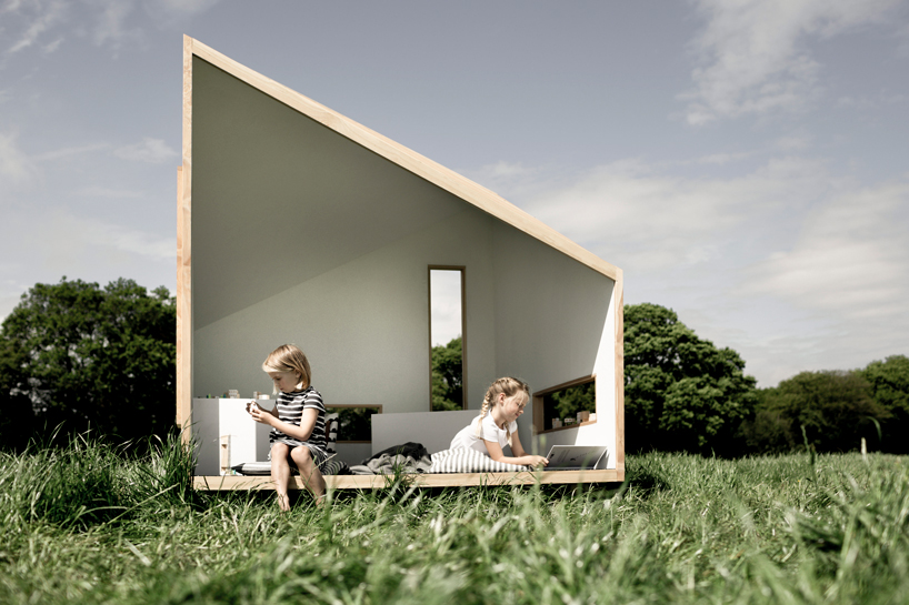 koto prefabricates the 'ilo playhouse' for children using larch timber and recycled rubber designboom