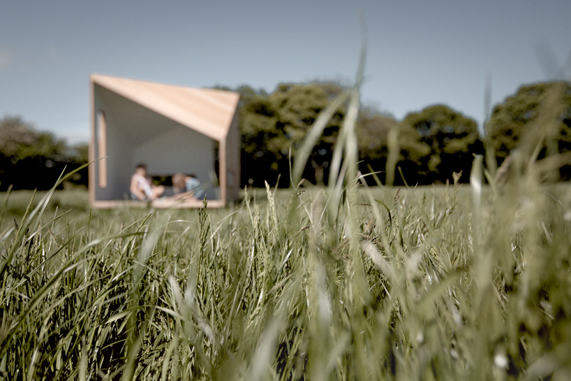 koto prefabricates the 'ilo playhouse' for children using larch timber and recycled rubber designboom