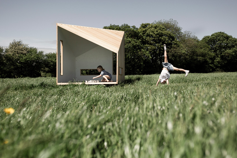 koto prefabricates the 'ilo playhouse' for children using larch timber and recycled rubber designboom