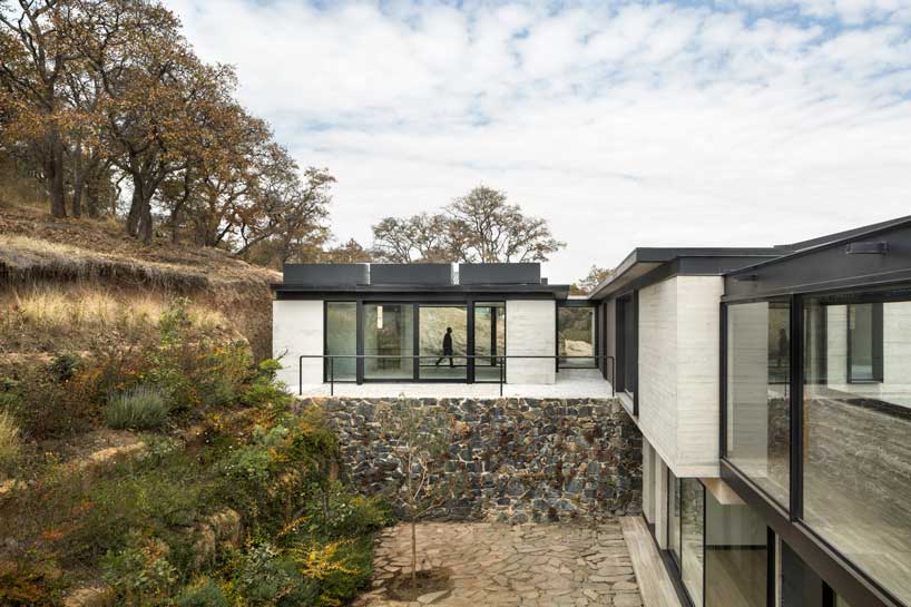ZD+A designs a family house in mexico using local stone to create a dialogue with nature