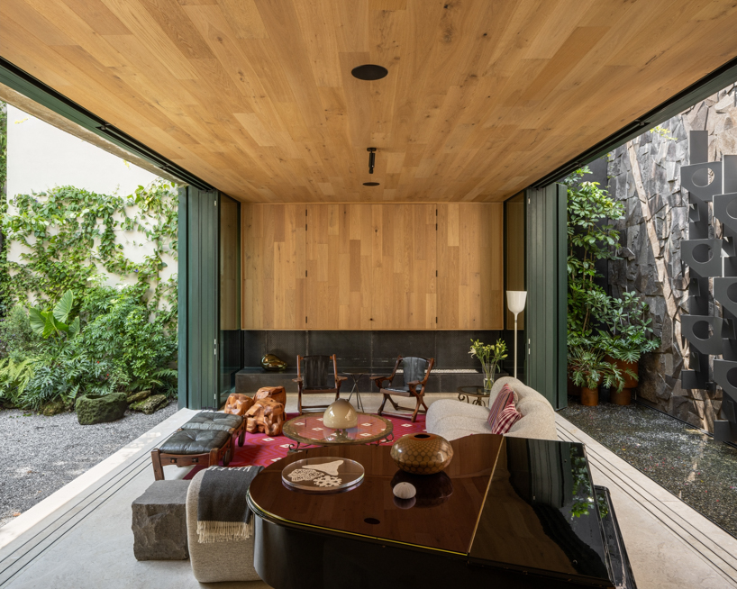 casa kiki revives a 1930s california-style home around a pink turret in mexico city - 7