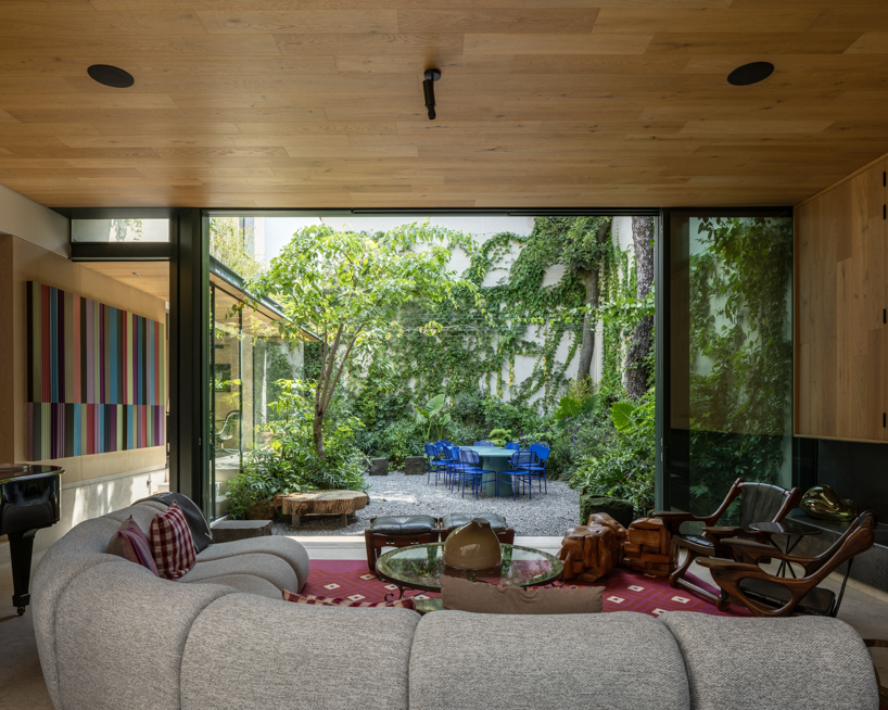 casa kiki revives a 1930s california-style home around a pink turret in mexico city - 9