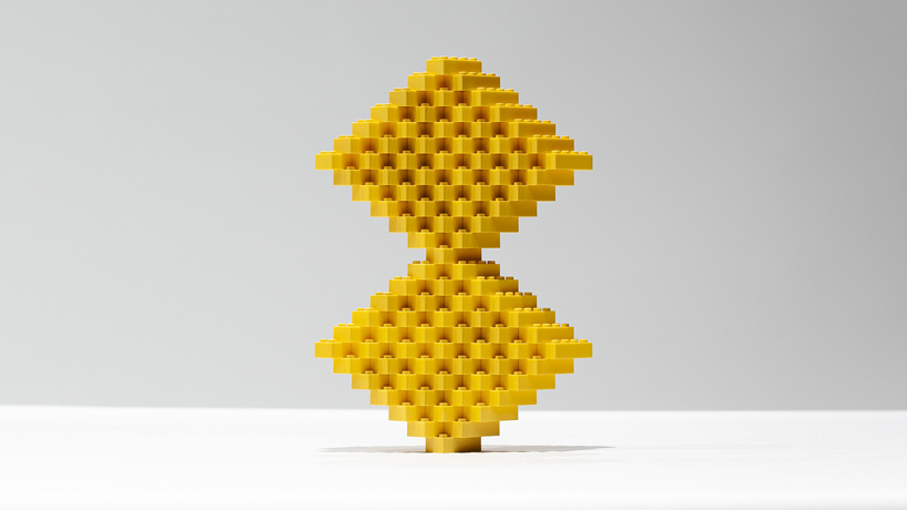 reza aliabi constructs surreal towers using only 2x4 yellow LEGO bricks