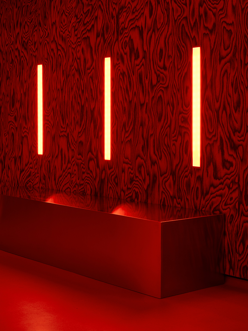clap studio renovates valencia's oven club with red-hot interiors and kinetic light grids