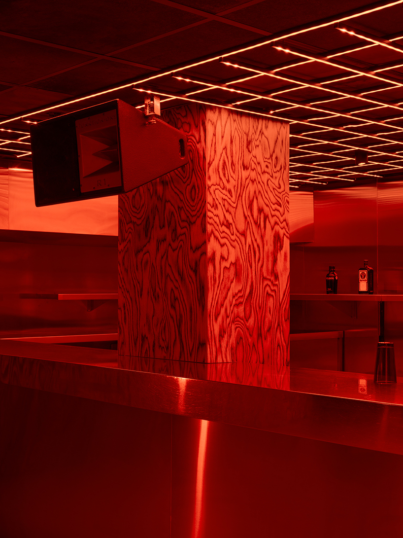 clap studio renovates valencia's oven club with red-hot interiors and kinetic light grids