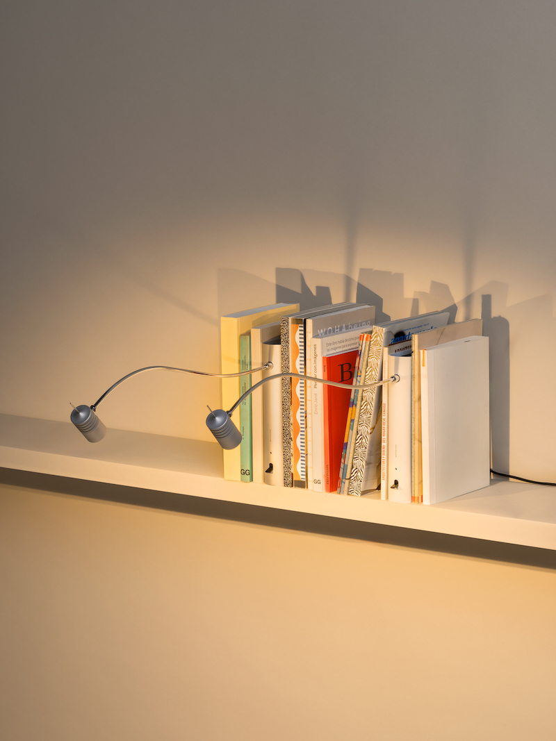 shaped like a book, oscar tusquets' bib luz lamp discreetly integrates into any shelf
