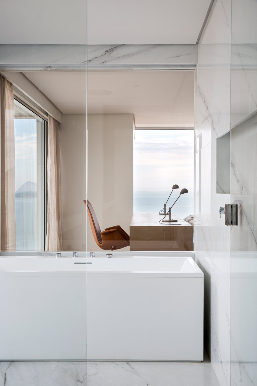 arthur casas frames rio de janeiro views in sophisticated apartment