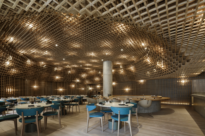 studio arthur casas installs detailed woodwork piece within kosushi restaurant in miami