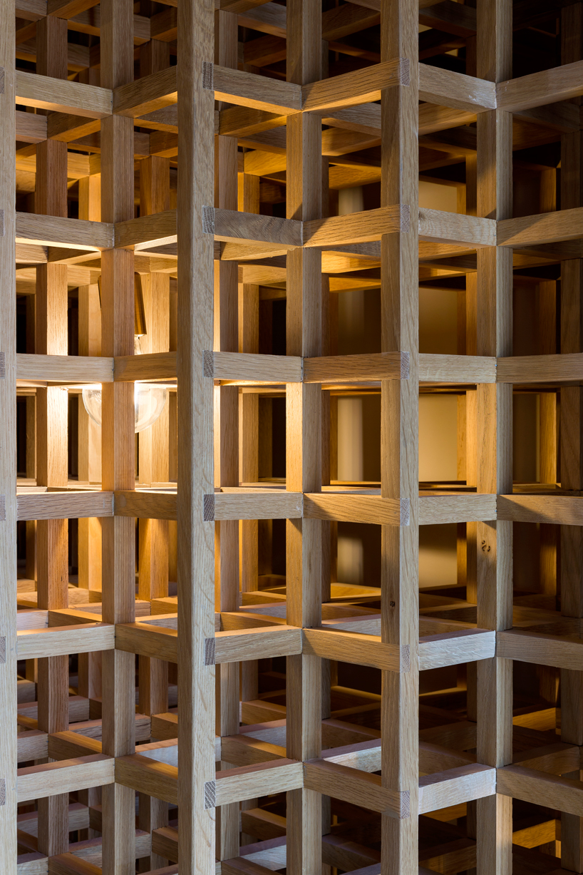 studio arthur casas installs detailed woodwork piece within kosushi restaurant in miami