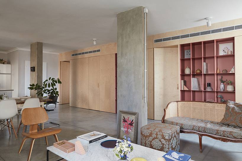 this apartment in tel aviv uses a wooden storage unit to separate private spaces thisisit designboom