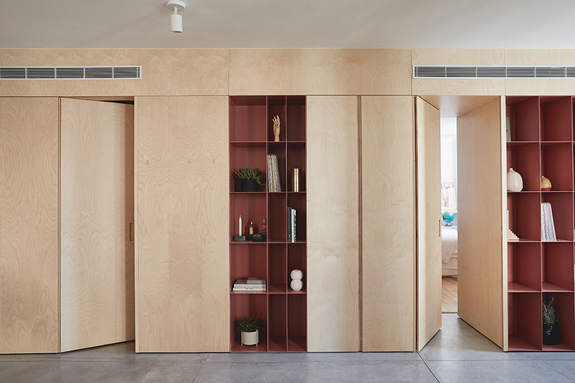 this apartment in tel aviv uses a wooden storage unit to separate private spaces thisisit designboom
