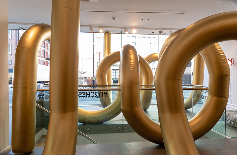 cyril lancelin fills ligne roset store with an inflatable maze of golden arches for LDF 2018