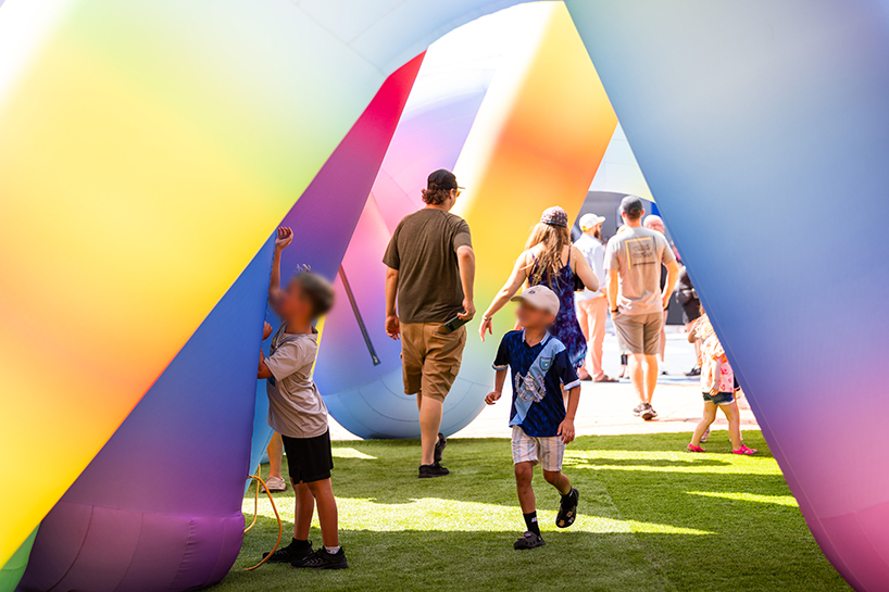 intertwined tubular forms shape inflatable rainbow labyrinth by cyril fancelin in grand rapids