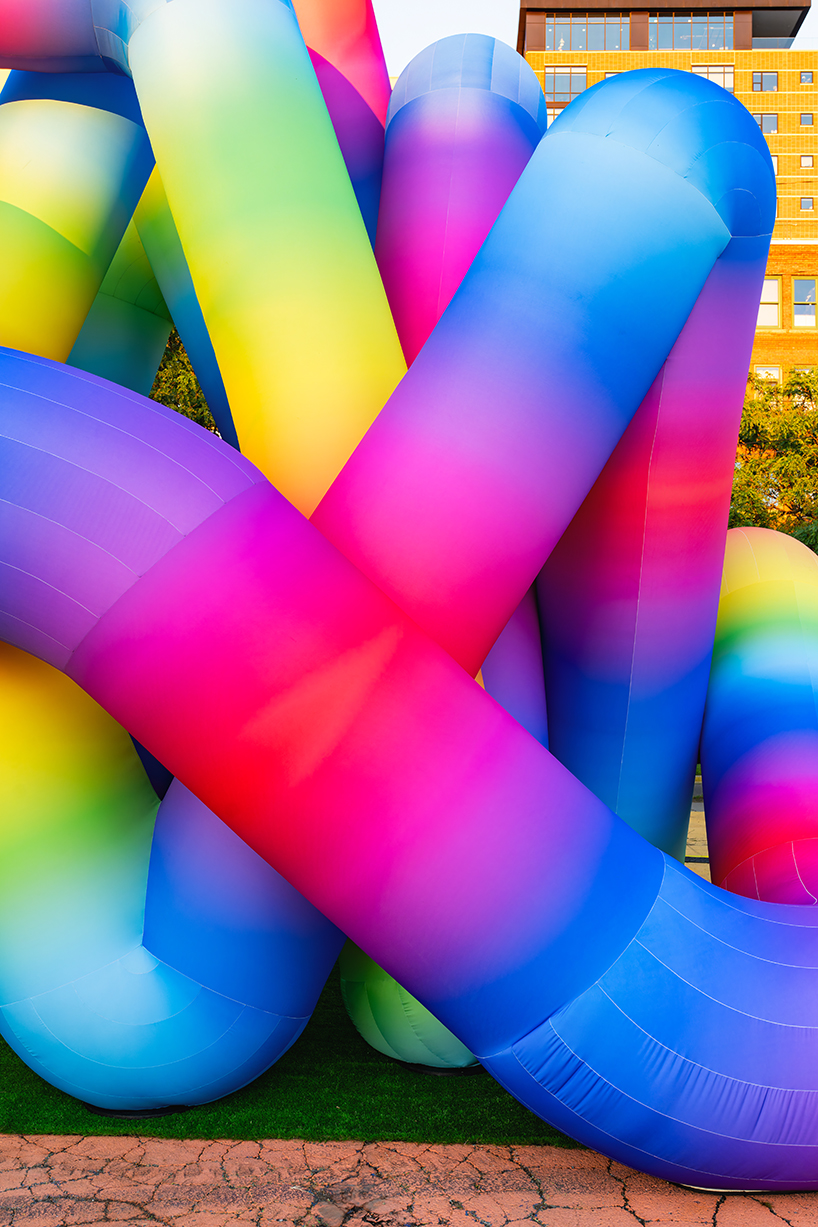 intertwined tubular forms shape inflatable rainbow labyrinth by cyril fancelin in grand rapids