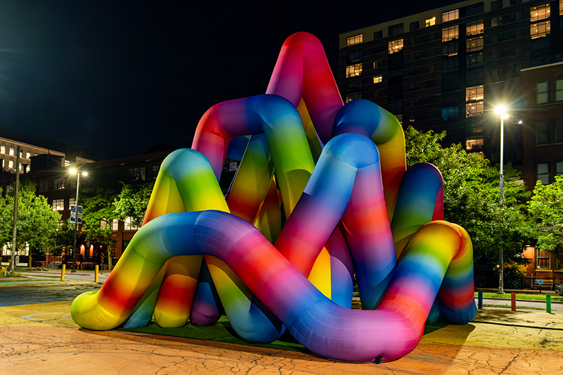 intertwined tubular forms shape inflatable rainbow labyrinth by cyril fancelin in grand rapids