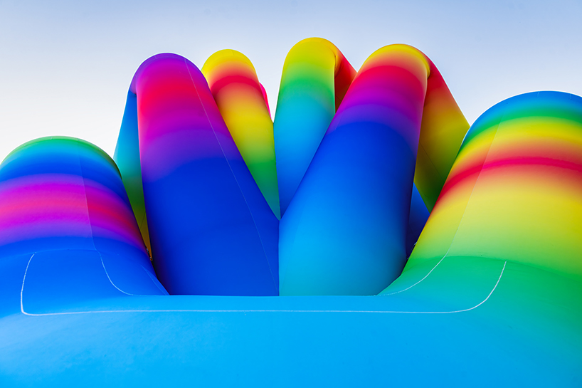 intertwined tubular forms shape inflatable rainbow labyrinth by cyril fancelin in grand rapids