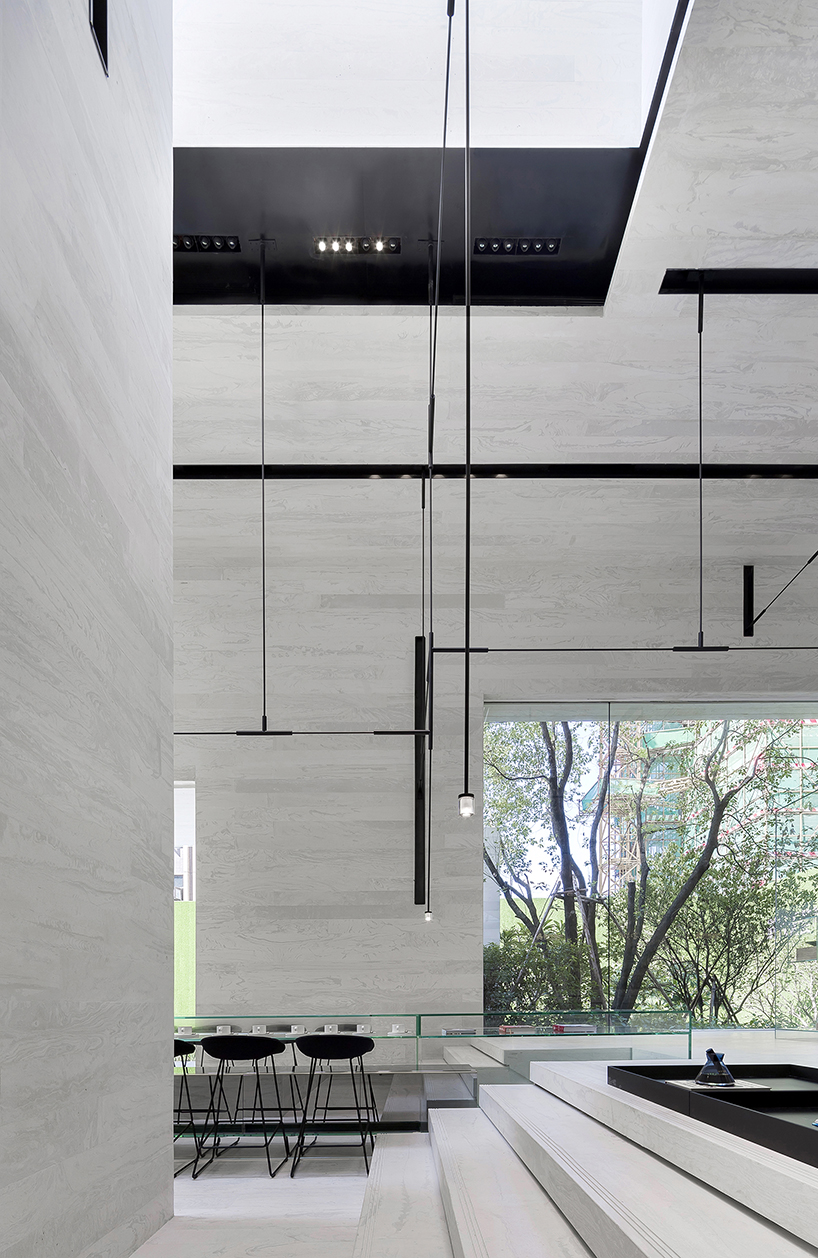 DOMANI's light-colored sky club house in china manifests a simple and vital atmosphere