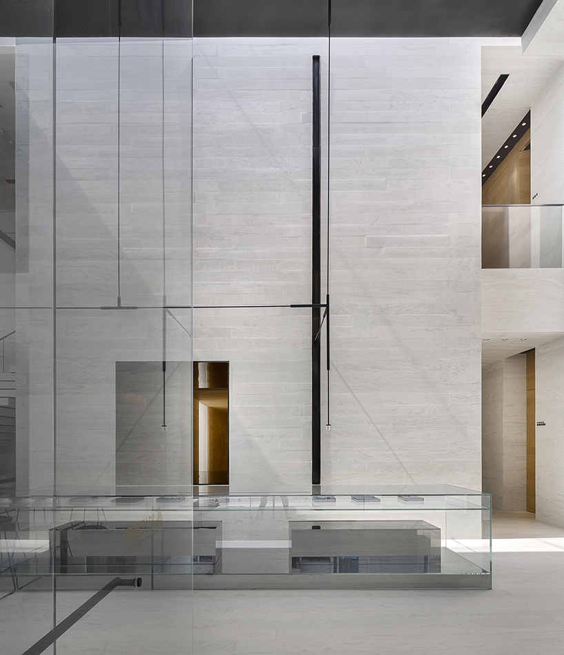 DOMANI's light-colored sky club house in china manifests a simple and vital atmosphere