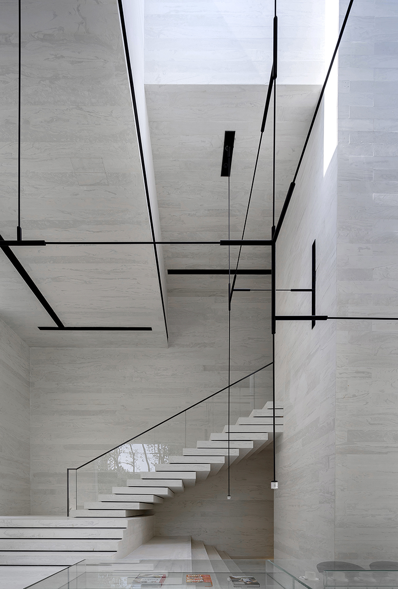 DOMANI's light-colored sky club house in china manifests a simple and vital atmosphere