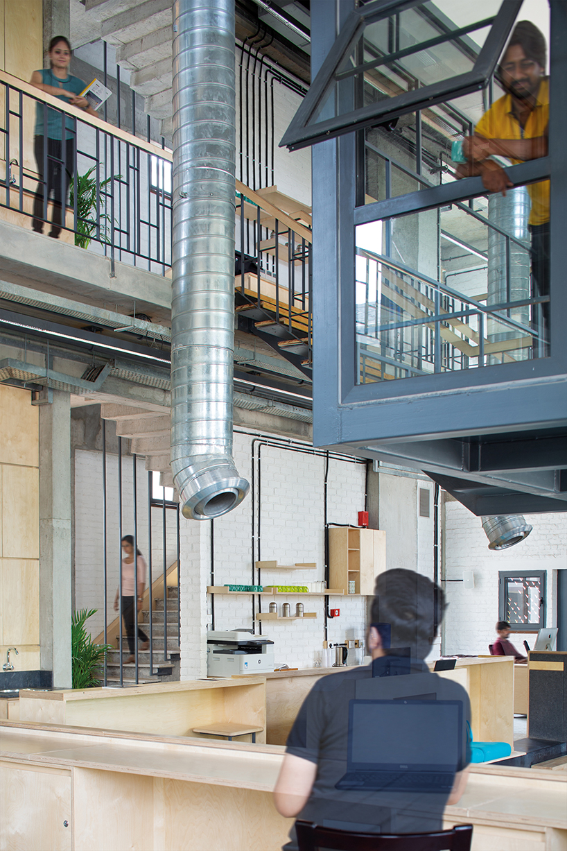 a brutalist concrete office building in india punctuated by corten steel, by groupDCA