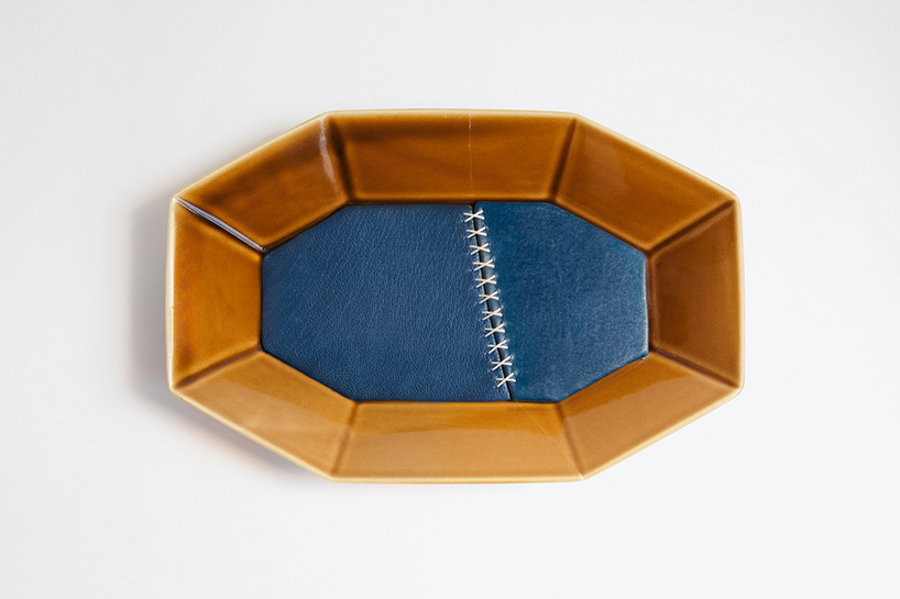 roee ben yehuda's kintsugi salvages fragmented ceramics with leather interventions