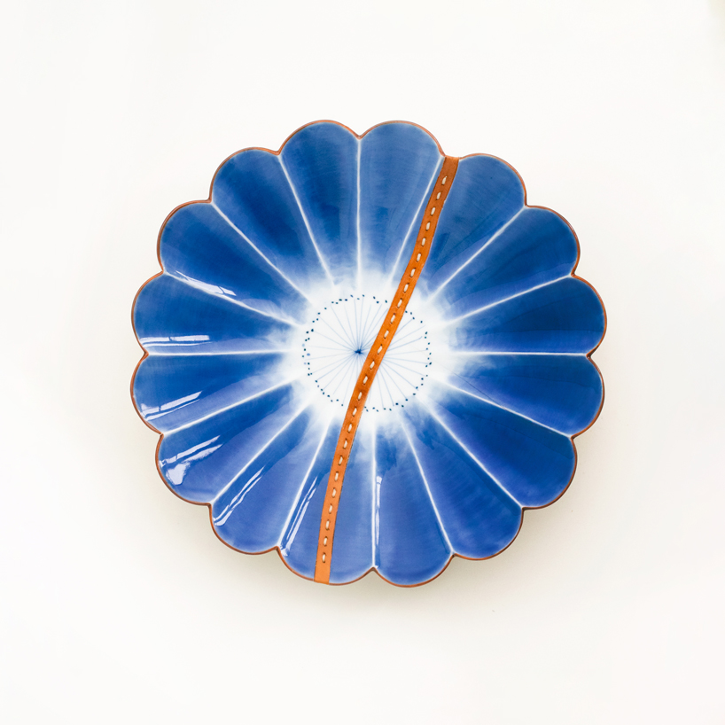 roee ben yehuda's kawatsugi salvages fragmented ceramics with leather interventions