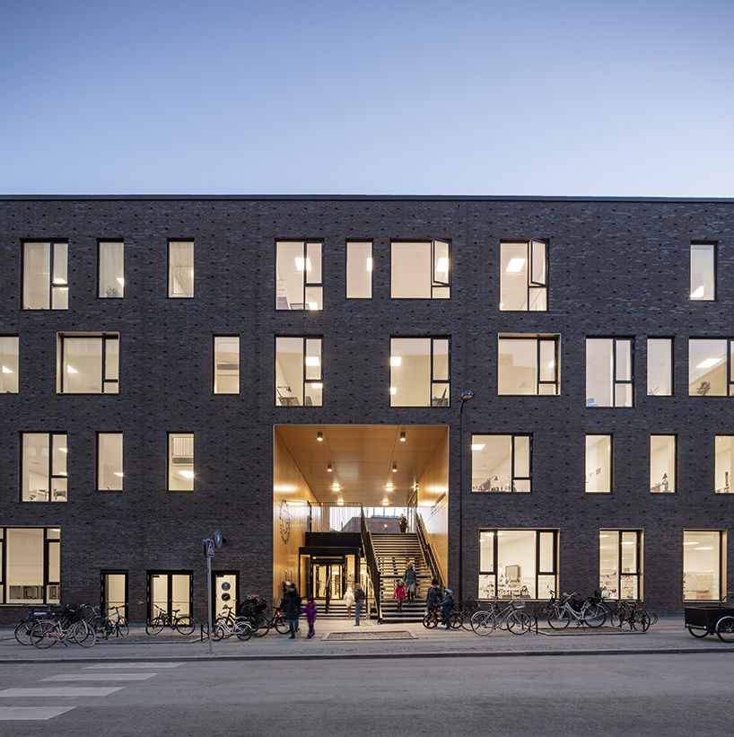 european school copenhagen clad with red bricks reflects its historical context