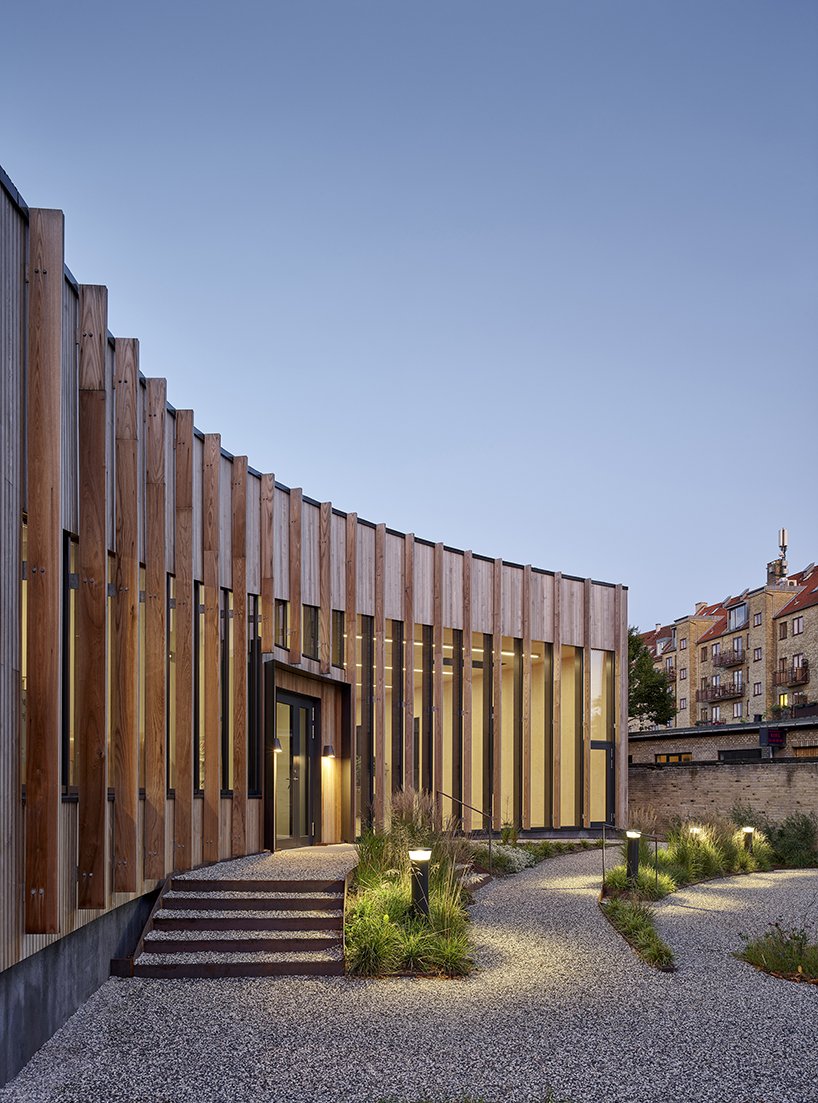 nord architects clads community center and parish in CLT wood in denmark