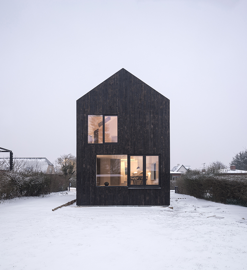 burnt timber composes barn villa by nord architects in copenhagen