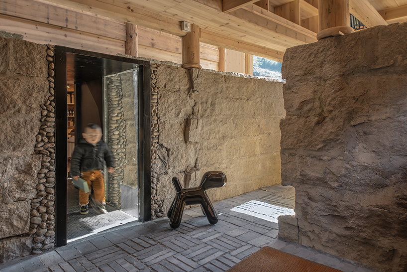 3andwich maintains rubble from chinese barn and transforms it into wooden bookstore