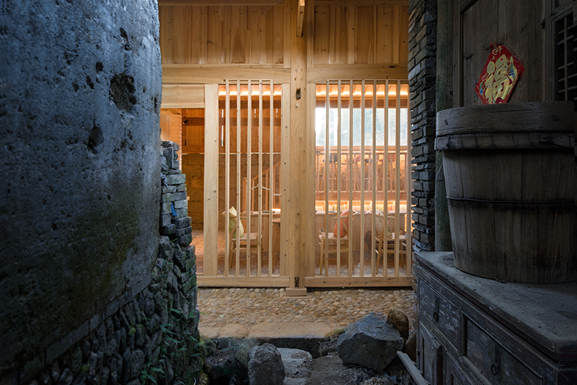 3andwich maintains rubble from chinese barn and transforms it into wooden bookstore