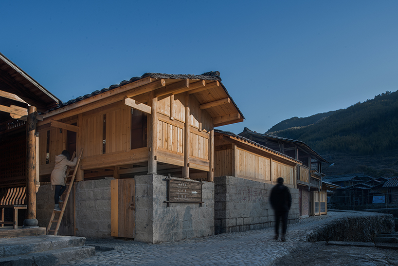 3andwich maintains rubble from chinese barn and transforms it into wooden bookstore