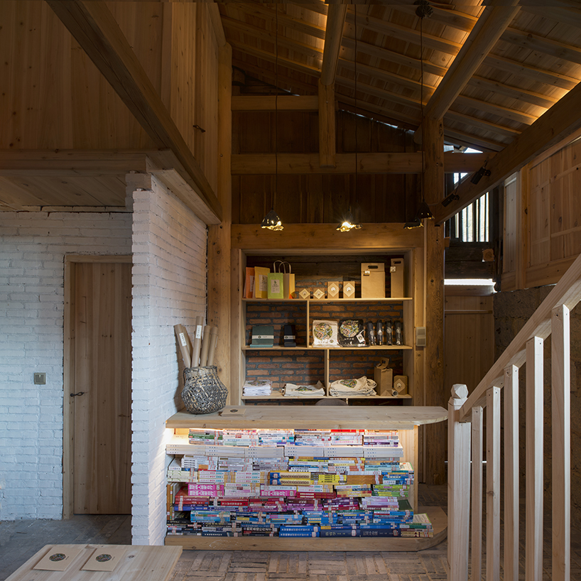 3andwich maintains rubble from chinese barn and transforms it into wooden bookstore
