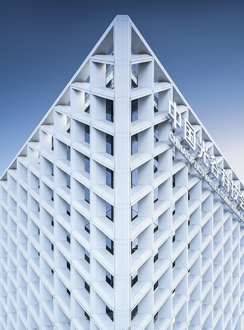 WSP architects' convention and exhibition center in china resembles an ivory carved statuette