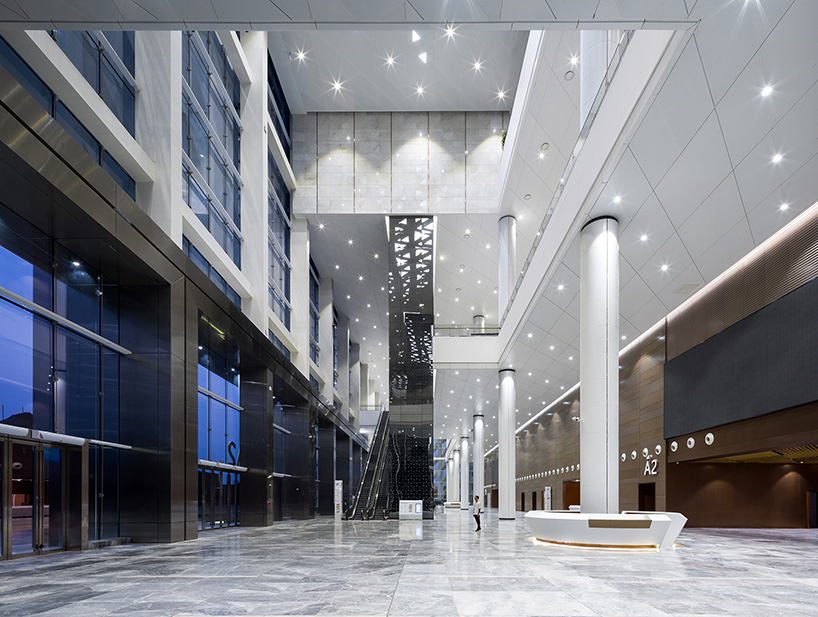 WSP architects' convention and exhibition center in china resembles an ivory carved statuette