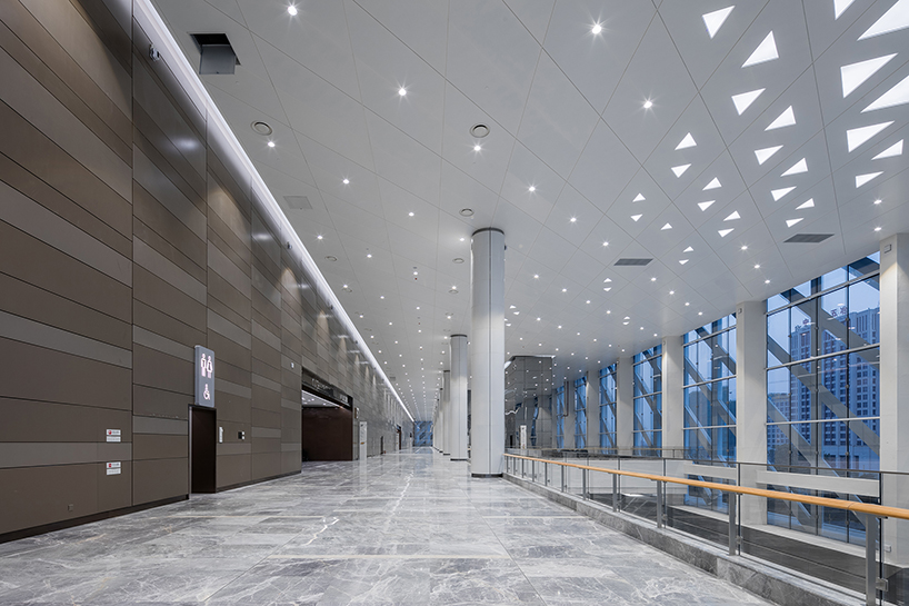 WSP architects' convention and exhibition center in china resembles an ivory carved statuette