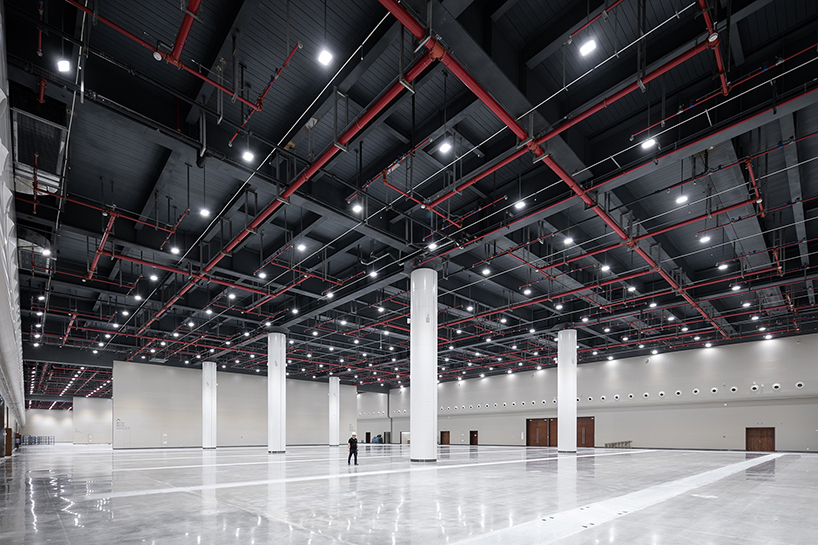 WSP architects' convention and exhibition center in china resembles an ivory carved statuette