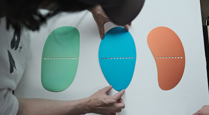 studio& nods to the japanese art of origami for the world’s thinnest bookend