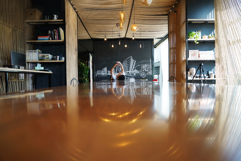 usual studio's chinese working space is decorated with naturally resourced materials