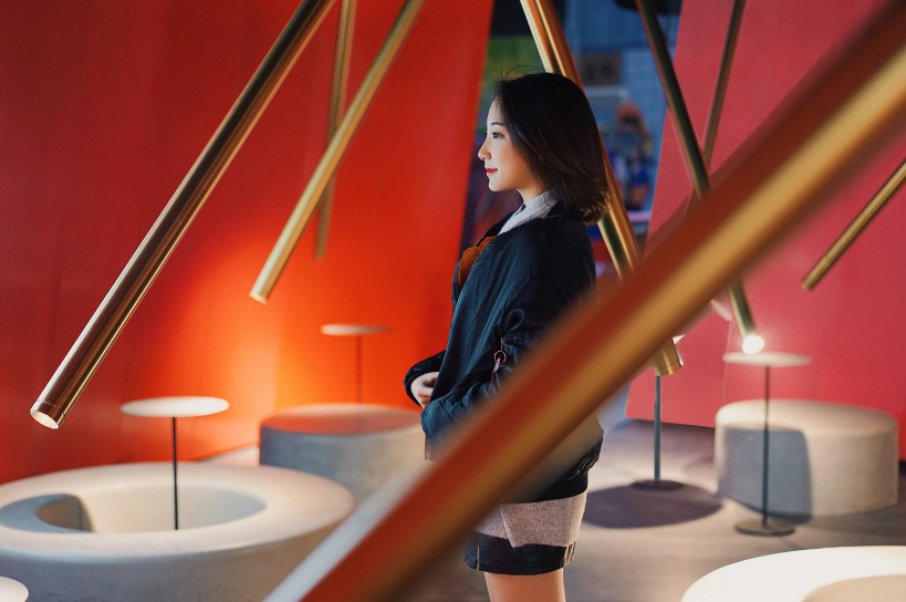 infinity nide's mole chha is a dome teahouse with red gradient walls and brass lighting tubes