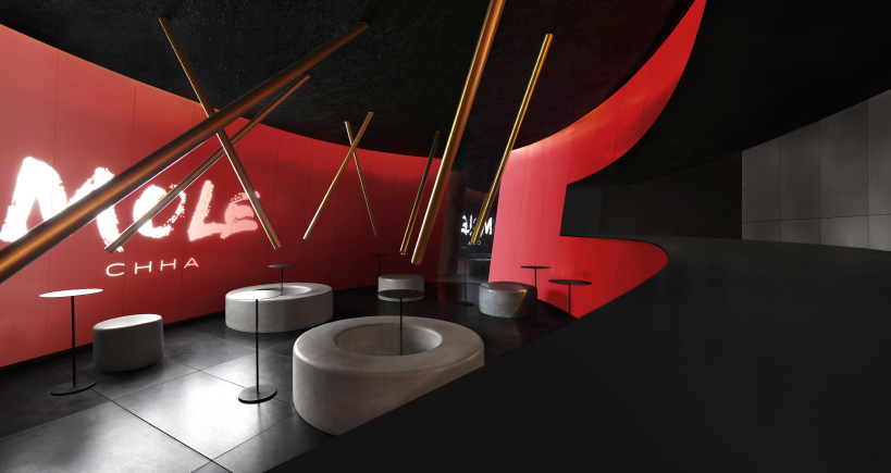 infinity nide's mole chha is a dome teahouse with red gradient walls and brass lighting tubes