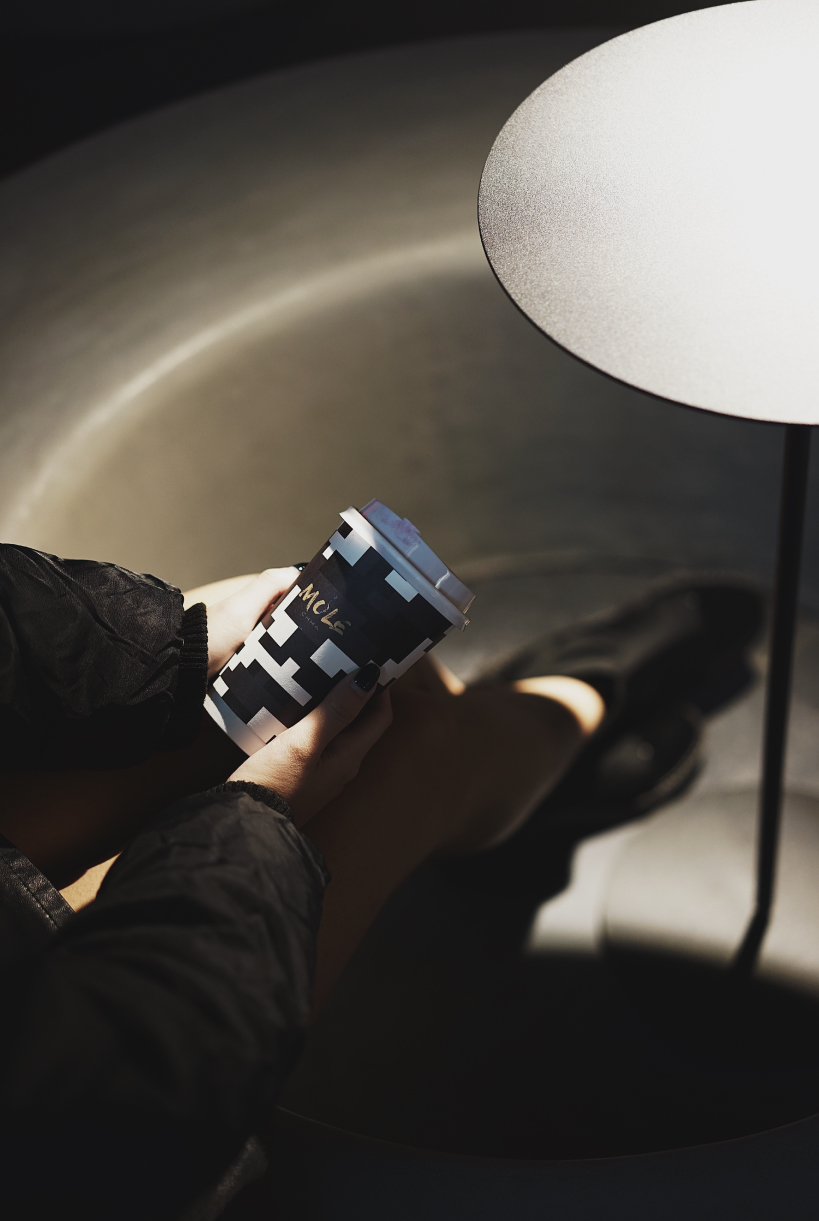 infinity nide's mole chha is a dome teahouse with red gradient walls and brass lighting tubes