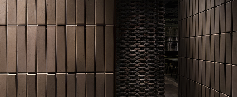 infinity nide brings the tradition of black chinese earthenware into restaurant interior