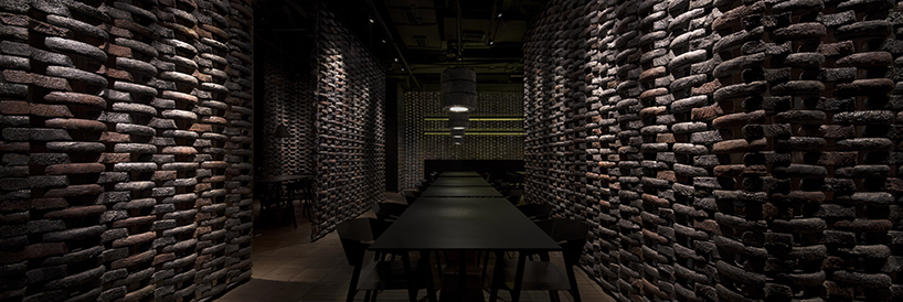 infinity nide brings the tradition of black chinese earthenware into restaurant interior