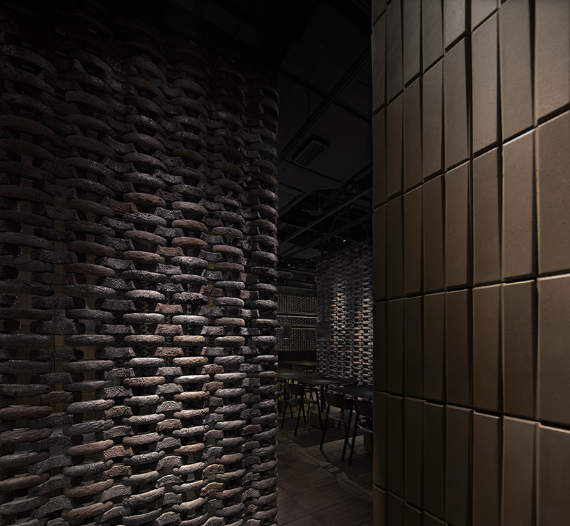 infinity nide brings the tradition of black chinese earthenware into restaurant interior