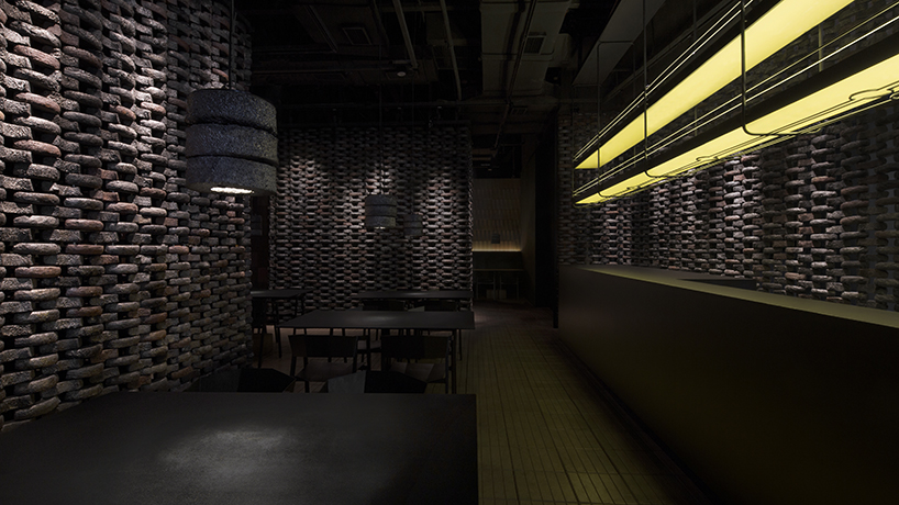 infinity nide brings the tradition of black chinese earthenware into restaurant interior